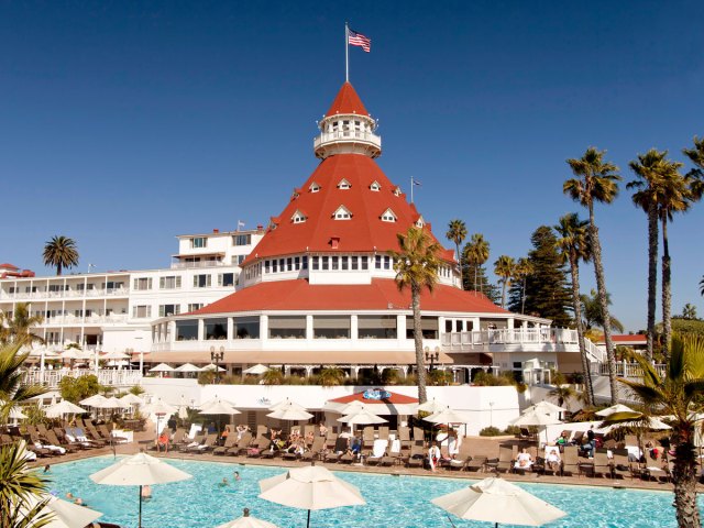 Pool and domed red-roofed building of the Hotel Coronado in Coronado, California
