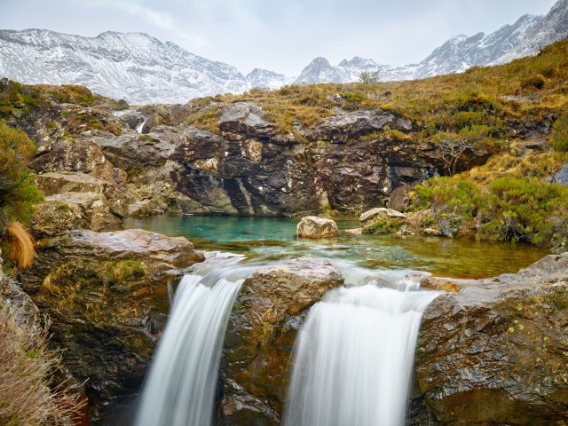 Fairy Pools of Scotland surrounded by mountains