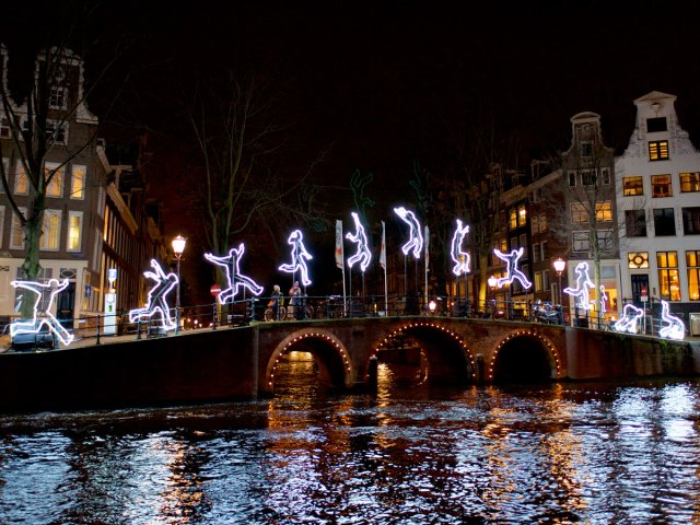 Bridge over canal in Amsterdam, decorated with holiday lights