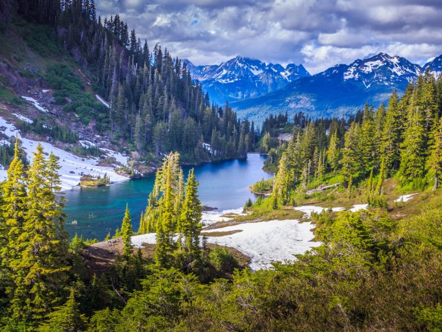 Forest, lake, and mountains in Montana's Glacier National Park