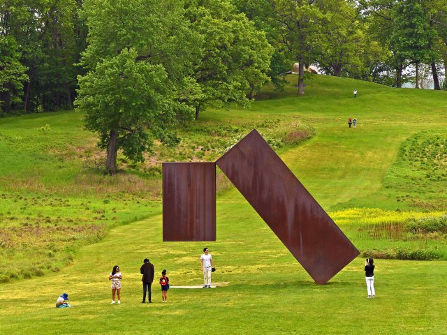 People viewing outdoor sculptures at Storm King Art Center in New York