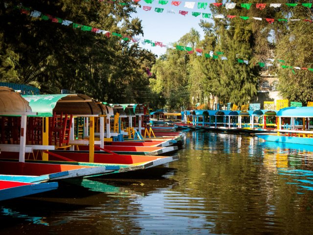 Colorful boats on canal in Xochimilco, Mexico