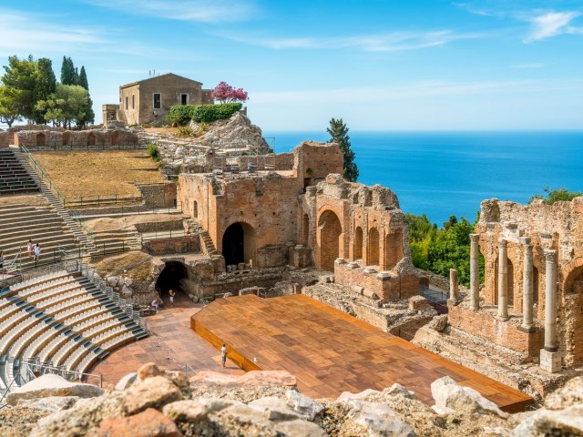 View of Greek Theater of Taormina in Sicily, Italy, overlooking the sea