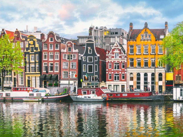Traditional row homes along canal in Amsterdam, the Netherlands