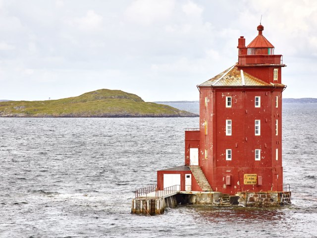 Red-painted Kjeungskjær Lighthouse in Norway
