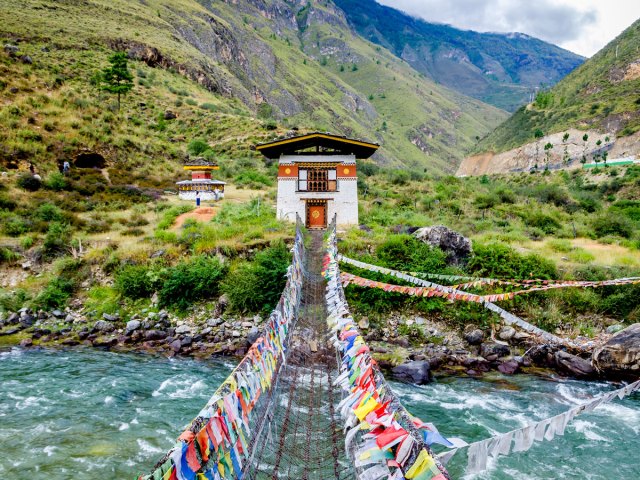 Bridge to Tamchog Lhakhang Monastery across Paro River in Bhutan