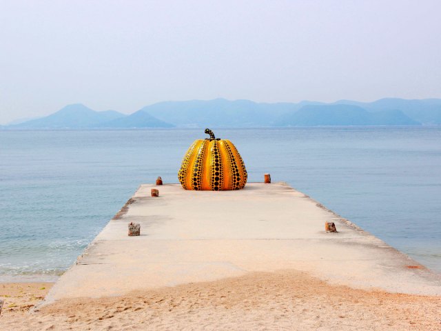 Giant pumpkin sculpture on pier on Japan's Naoshima Island