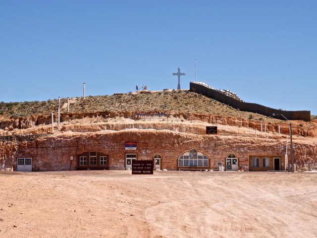 Exterior of homes built under rock in Coober Pedy, Australia