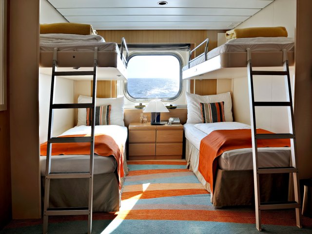 Interior of cruise ship cabin with porthole
