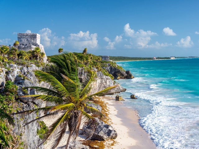 Archaeological ruins next to sandy beach in Tulum, Mexico