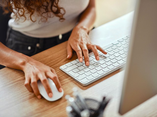 Close-up image of woman using computer