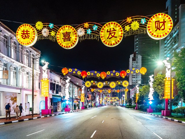 Lunar New Year decorations hanging over empty Singapore street at night