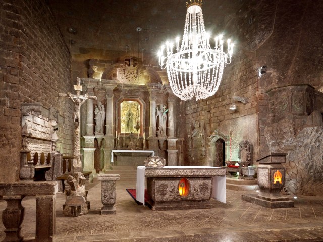 Underground chandelier and room filled with religious artifacts at Wieliczka Salt Mine in Poland