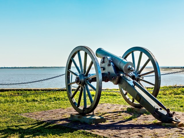 Cannon pointed over Charleston Harbor at Fort Sumter