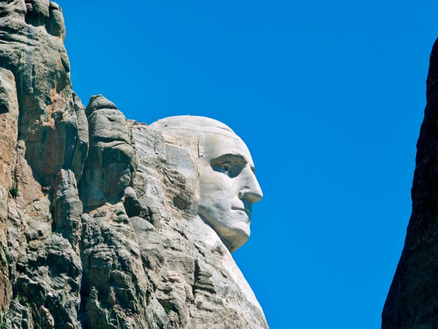 Close-up image of one of the giant presidential faces of Mount Rushmore