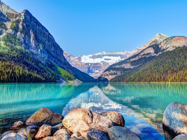 Turquoise waters reflecting the Canadian Rockies on Lake Louise in Banff National Park