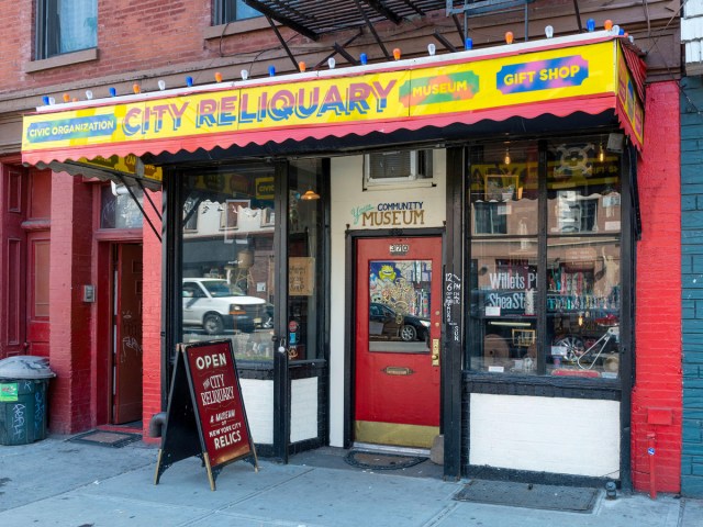 Entrance to City Reliquary in Brooklyn, New York City, with brightly colored awning