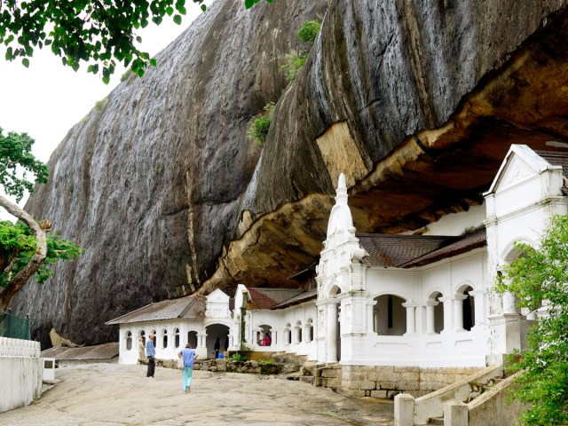 White-painted exterior of Dambulla Cave Temple in Sri Lanka, built into side of cave
