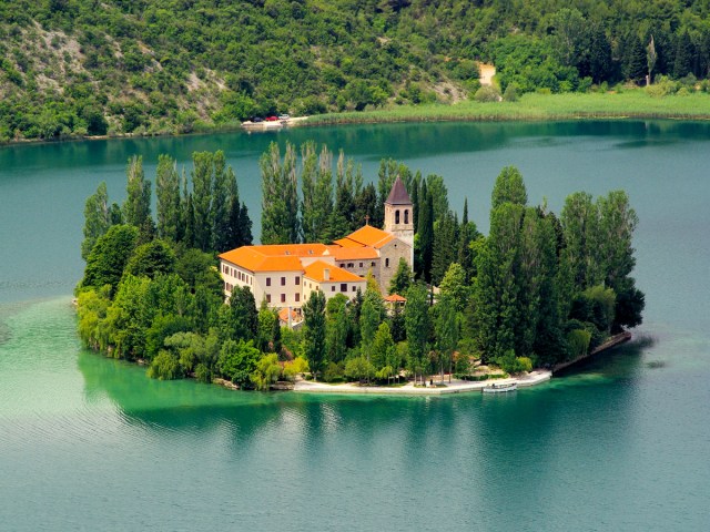 Aerial view of Visovac Monastery on small island in the middle of a river in Croatia's Krka National Park
