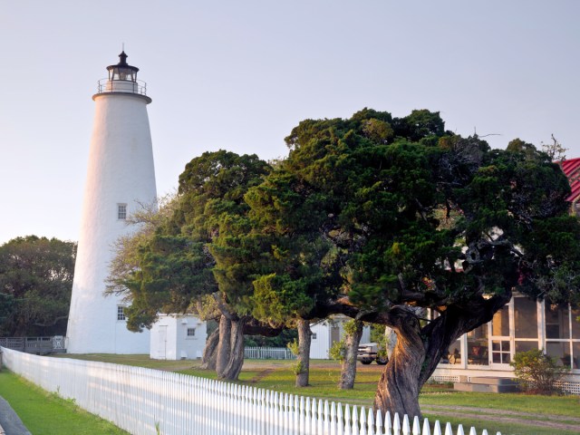 Lighthouse and white-picket fence in the Outer Banks of North Carolina