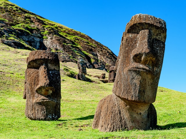 Close-up view of moai statue on grassy hill of Easter Island