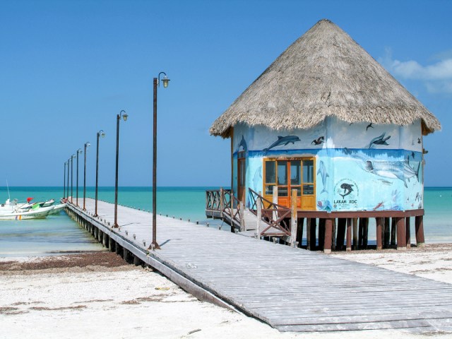 Colorfully painted beach hut and pier on Isla Holbox in Mexico
