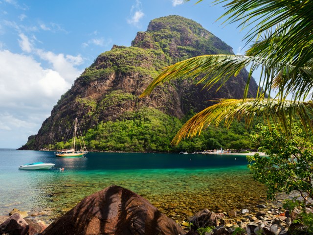 View of the Pitons mountain and boats in bay in St. Lucia