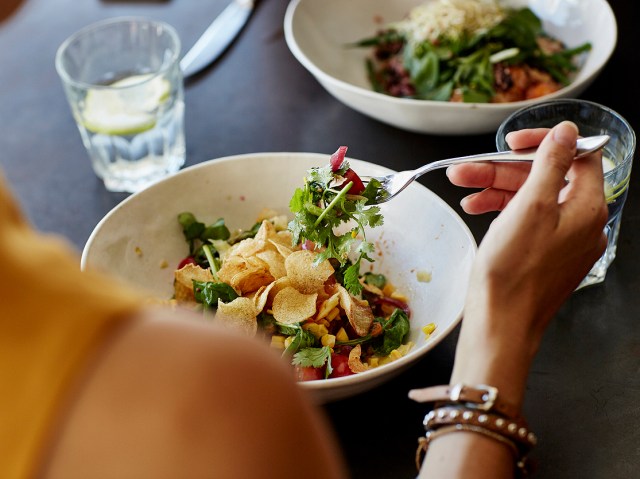 Close-up of person eating a salad