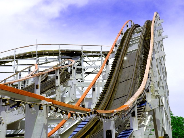 Close-up view of dip in track of wooden roller coaster