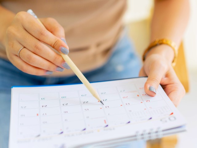 Close-up image of person marking calendar