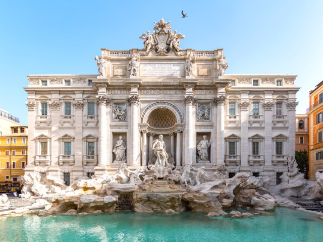 Ornate statues and building lining the Trevi Fountain in Rome, Italy