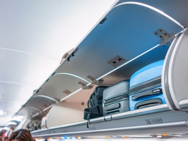 Carry-on baggage stowed in aircraft overhead bins