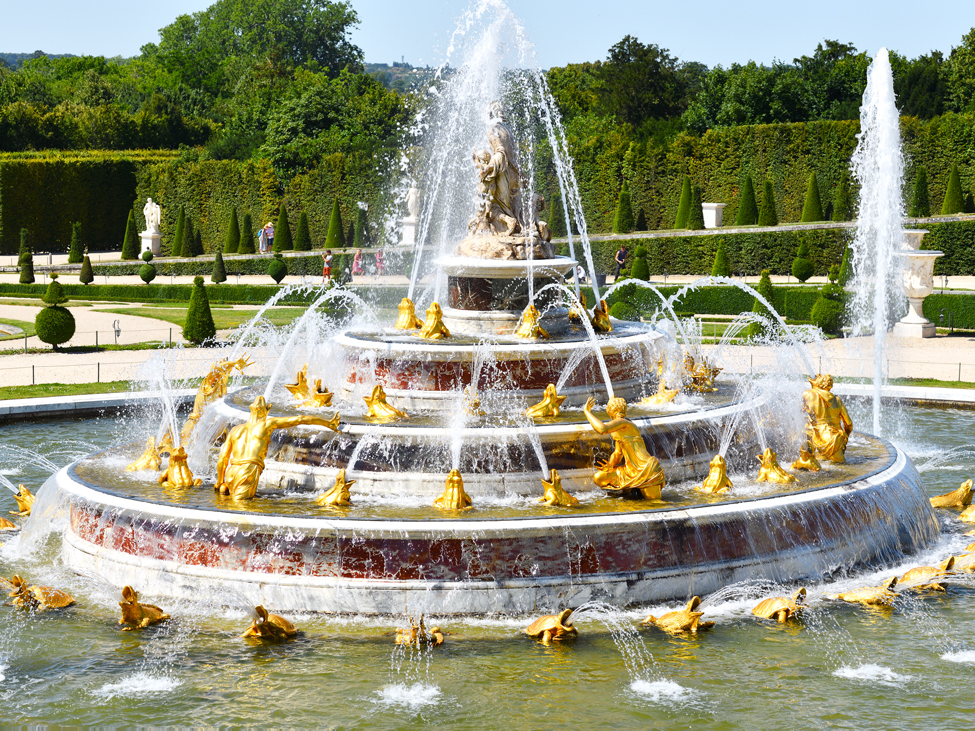 Gold statues lining the Fountains of the Parc de Versailles in Versailles, France