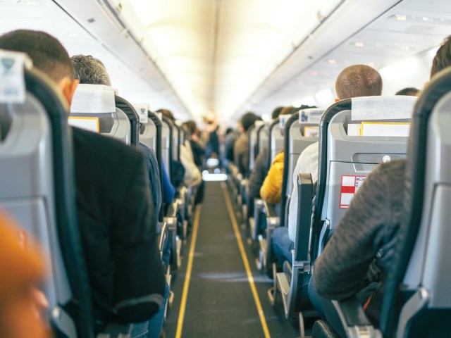 View of airplane cabin from back