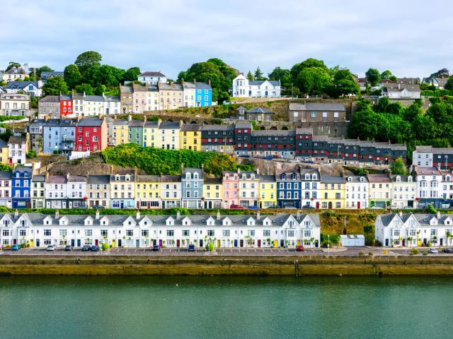 Rows of colorful homes along the water in Cobh, Ireland