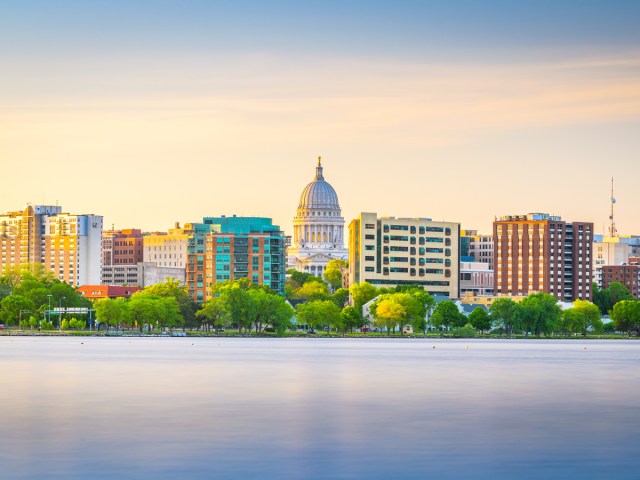 Skyline of Madison with Wisconsin State Capitol seen across lake