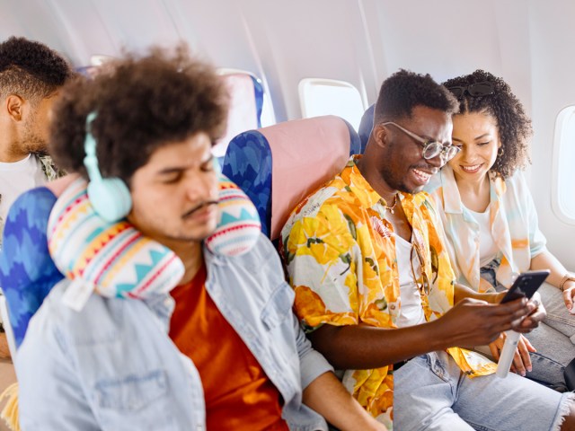 Passengers seated on airplane