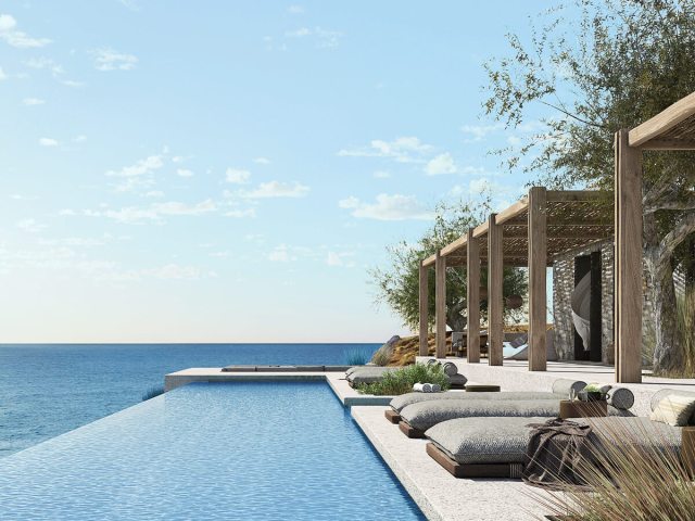 Cabanas, loungers, and infinity pool overlooking the Aegean Sea at Gundari Resort in Folegandros, Greece