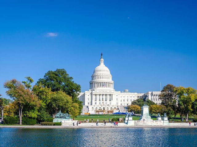 View of United States Capitol Building across river in Washington, D.C.