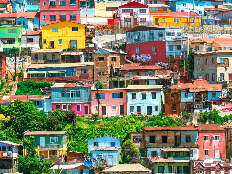 Homes painted in bright colors on steep hillside in Valparaíso, Chile