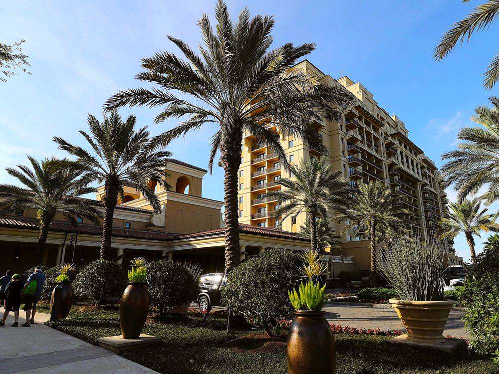 Palm trees and exterior of Four Seasons Resort Orlando