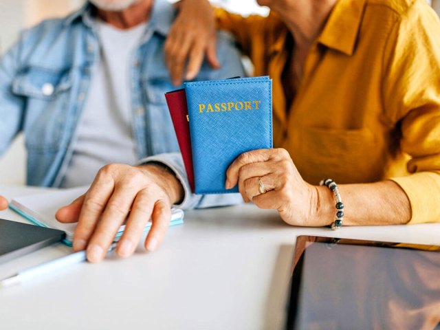 Close-up image of couple holding passports