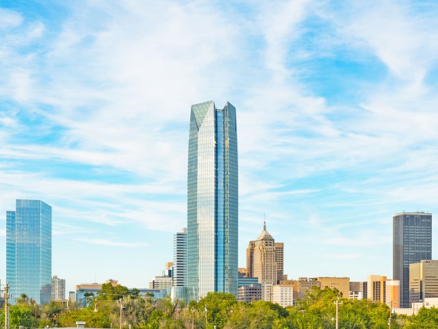 Modern glass-covered Devon Energy Center, the tallest building in Oklahoma City, seen from afar