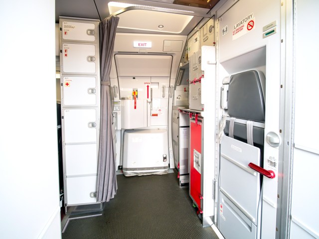 Flight attendant jump seat and galley area on aircraft