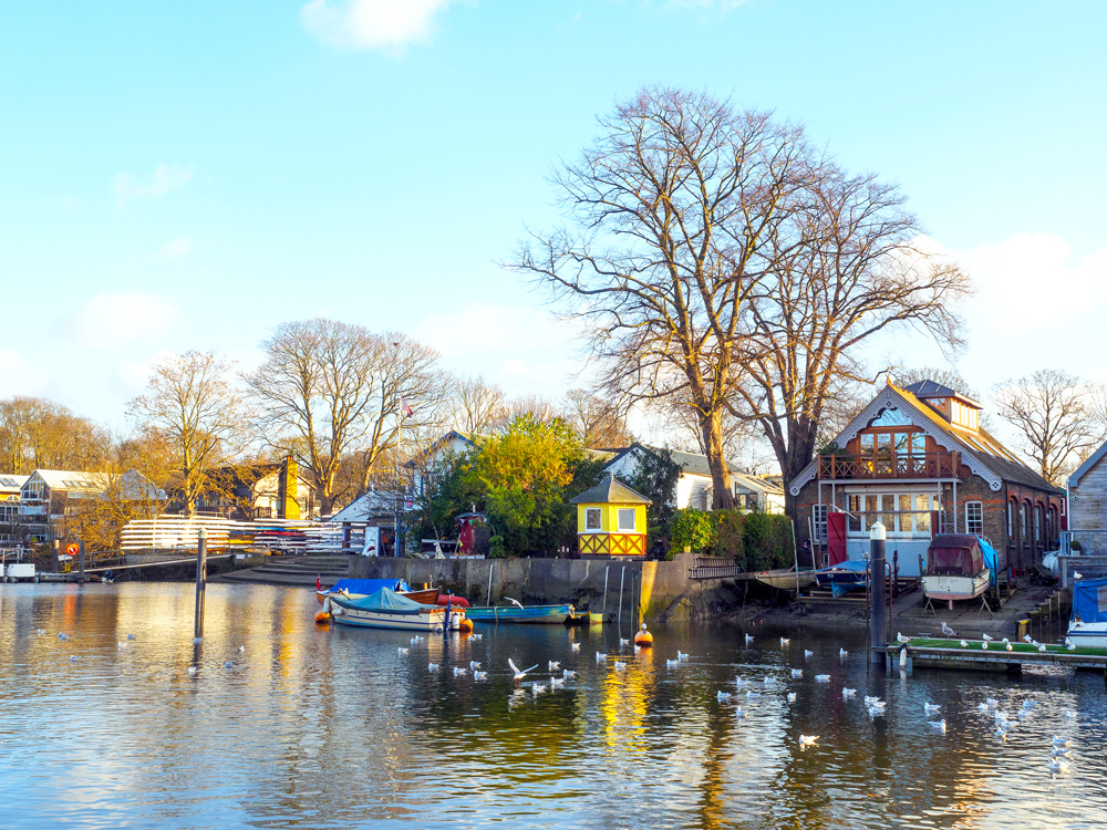 Waterfront homes and boats on Eel Pie Island in London, England