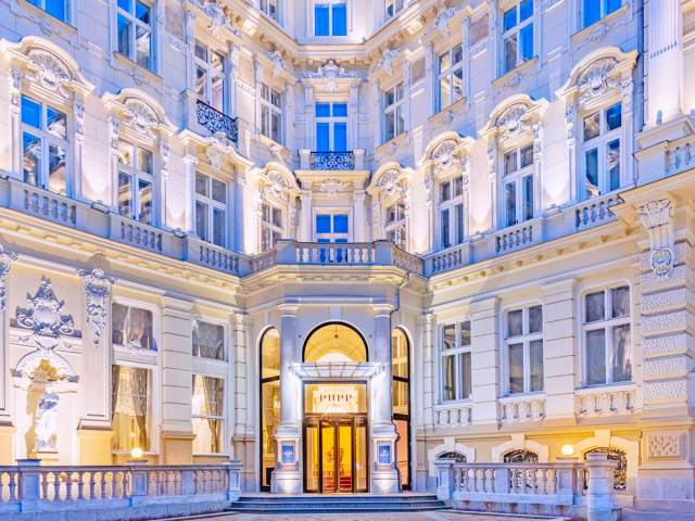 Entrance to Grand Hotel Pupp in Karlovy Vary, Czechia, lit at night