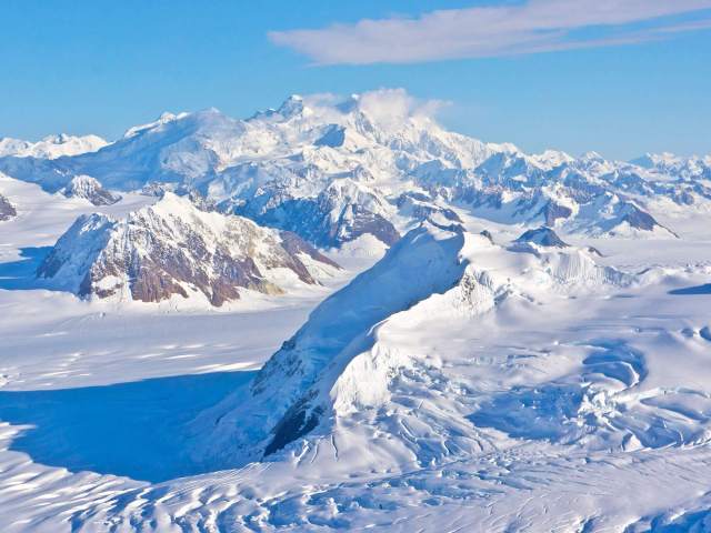 Aerial view of snowy landscape of Mount Alverstone in Alaska