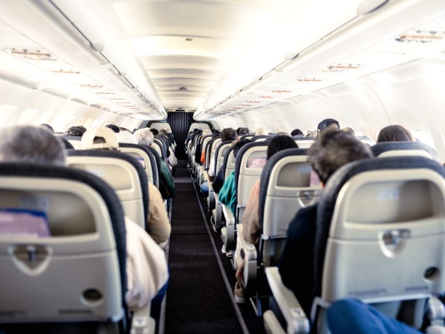 View of airplane cabin from rear