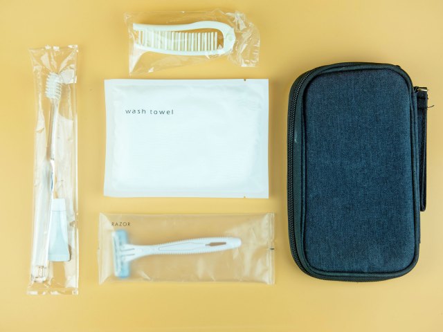 Contents of hotel amenity kit laid out on table