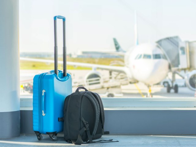 Unattended carry-on bag and backpack in airport terminal